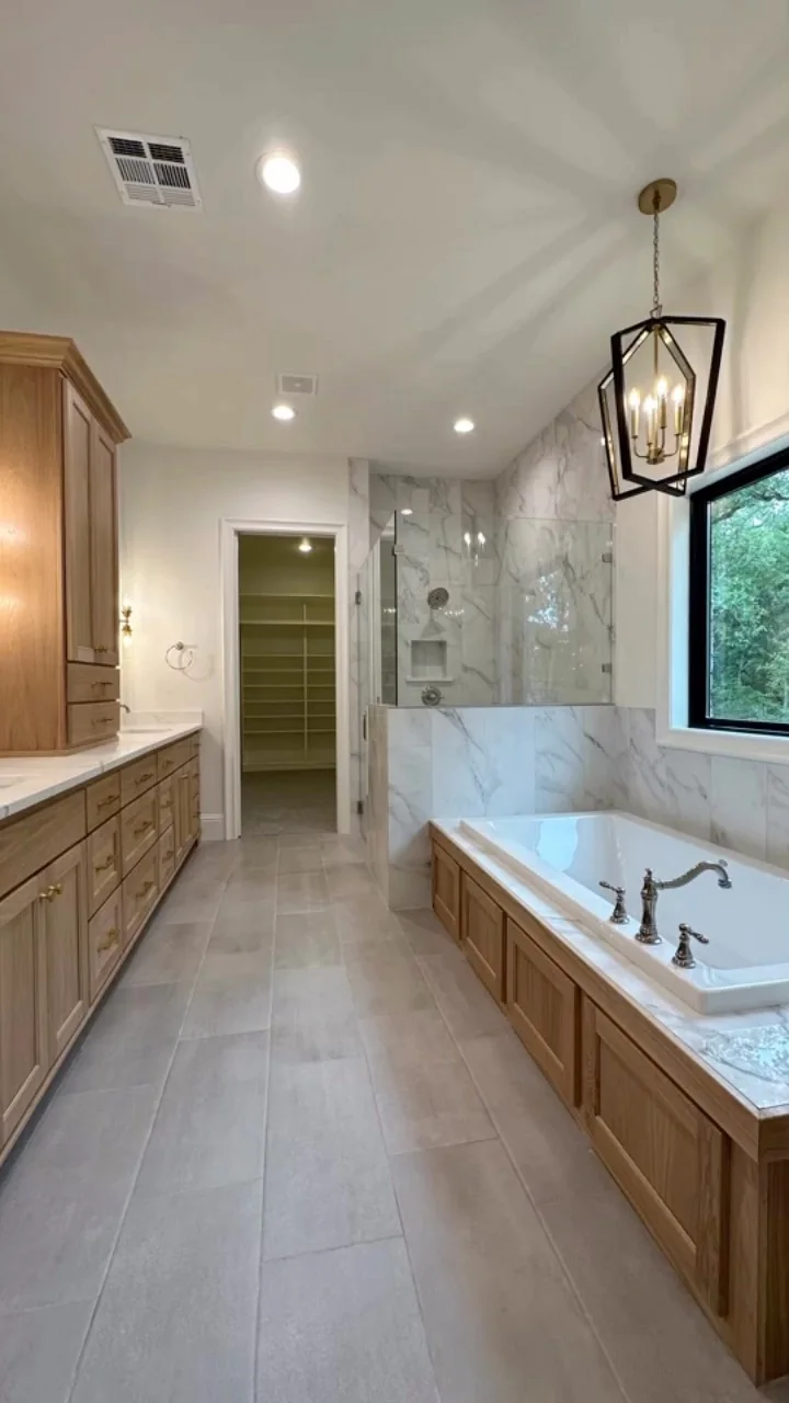 A primary bathroom in a Tredway custom home